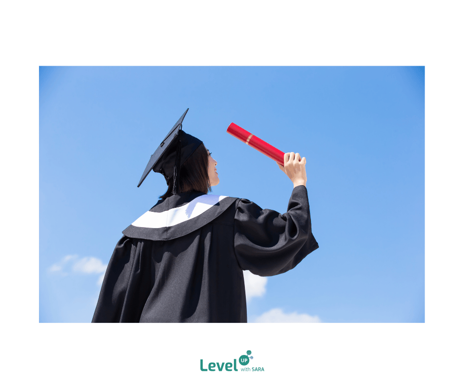 Girl holding her degree as a symbol of succeesing at school with the help of level up with Sara