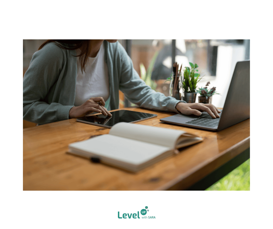 girl studying, doing online tutoring with a laptop and tablet